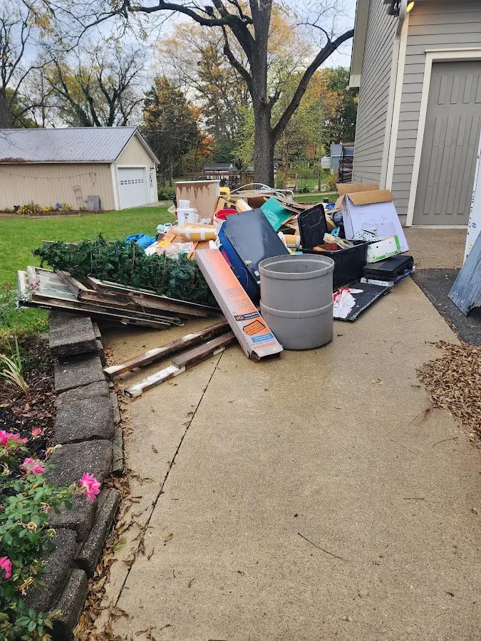 Dumpster being loaded with debris for 3 Yard Dumpster Rental in Salisbury